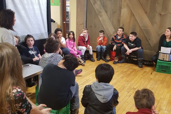 People sitting in a circle and having a discussion.
